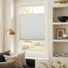 White custom cellular blackout shade, top-down bottom-up, no-drill installation.