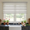 Linen-look zebra shade in white, custom window treatment with light-filtering sheer bands