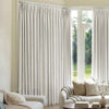 Custom light grey Mason triple weave blackout curtains with elegant pleats.