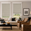 Custom blackout Roman shade in textured gray fabric on living room windows