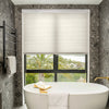 Solace Light Filtering Cellular Shade in cream, offering soft light and privacy for window treatments.