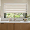 Marlow Light Filtering Zebra Shade with alternating beige and white bands.