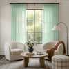 Light green Meadow Geometric Sheer Curtain with subtle jacquard weave and pom-pom trim.