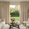 Haven Linen Blend Blackout Curtain in neutral beige with elegant pleats, shown in a stylish living room.