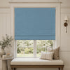 Blue faux linen blackout Roman shade in a no-drill inside mount over a window