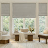 Grey faux linen blackout Roman shade with tailored folds, ideal custom window treatment.