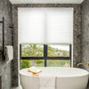 Solace Light Filtering Cellular Shade in white, controls soft light.