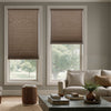 Nora light filtering cellular shades in taupe, lowering daylight and adding privacy