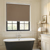 Custom Ashby taupe plain weave blackout roller shade for window treatments.