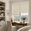 Beige linen blend blackout Roman shades on two windows in a bright home office