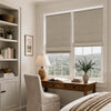 Beige linen blend blackout Roman shades on double windows in a calm bedroom office